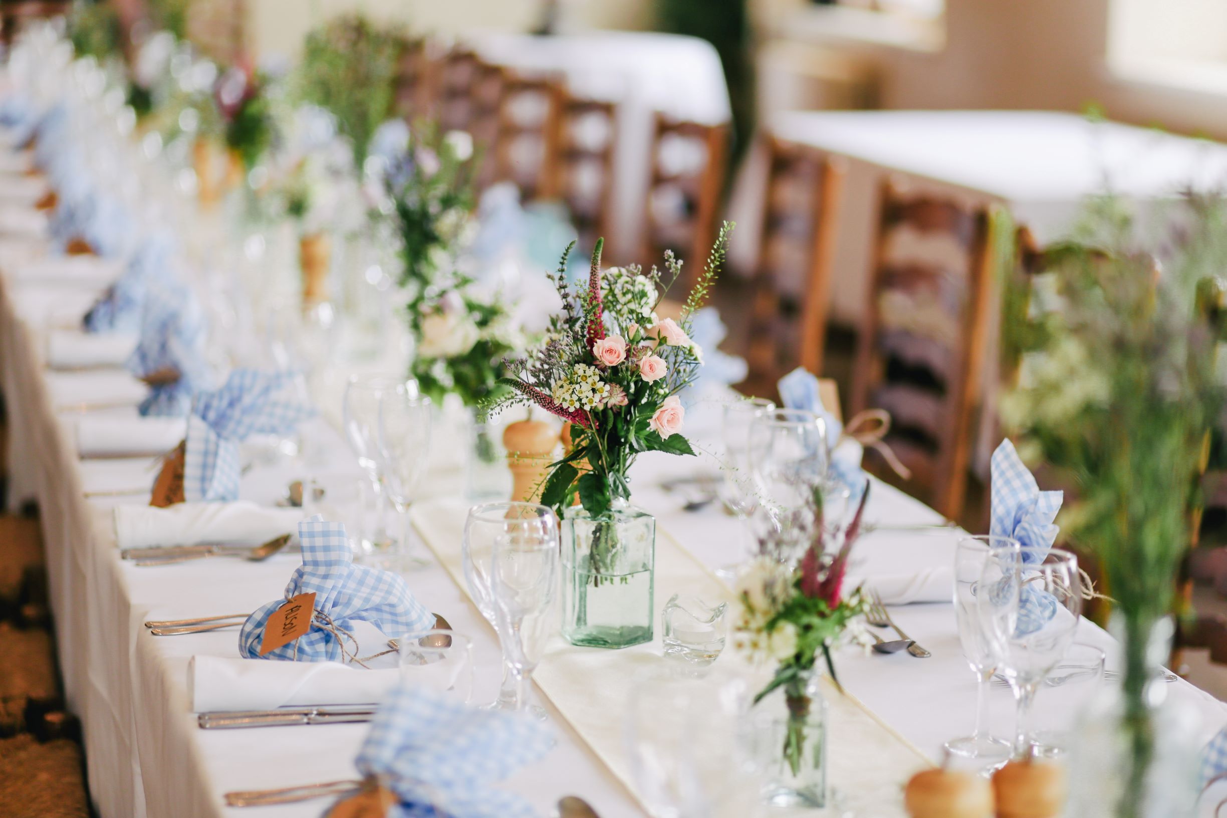 Wedding table styled with flowers, tableware and glassware